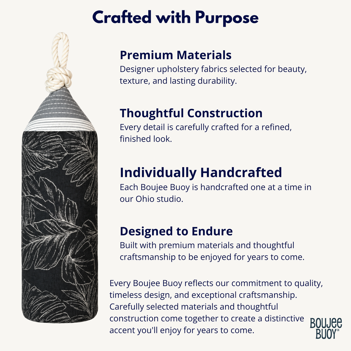 A Boujee Bouye decorative buoy with a black and white botanical pattern, a gray and white striped top, and a white rope loop, shown on a light gray background with descriptive text about premium materials, thoughtful construction, handcrafted details, and designed endurance.